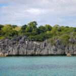 Volcanic rocks form an edge to an island