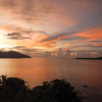 Pale pink and orange sunset over the ocean